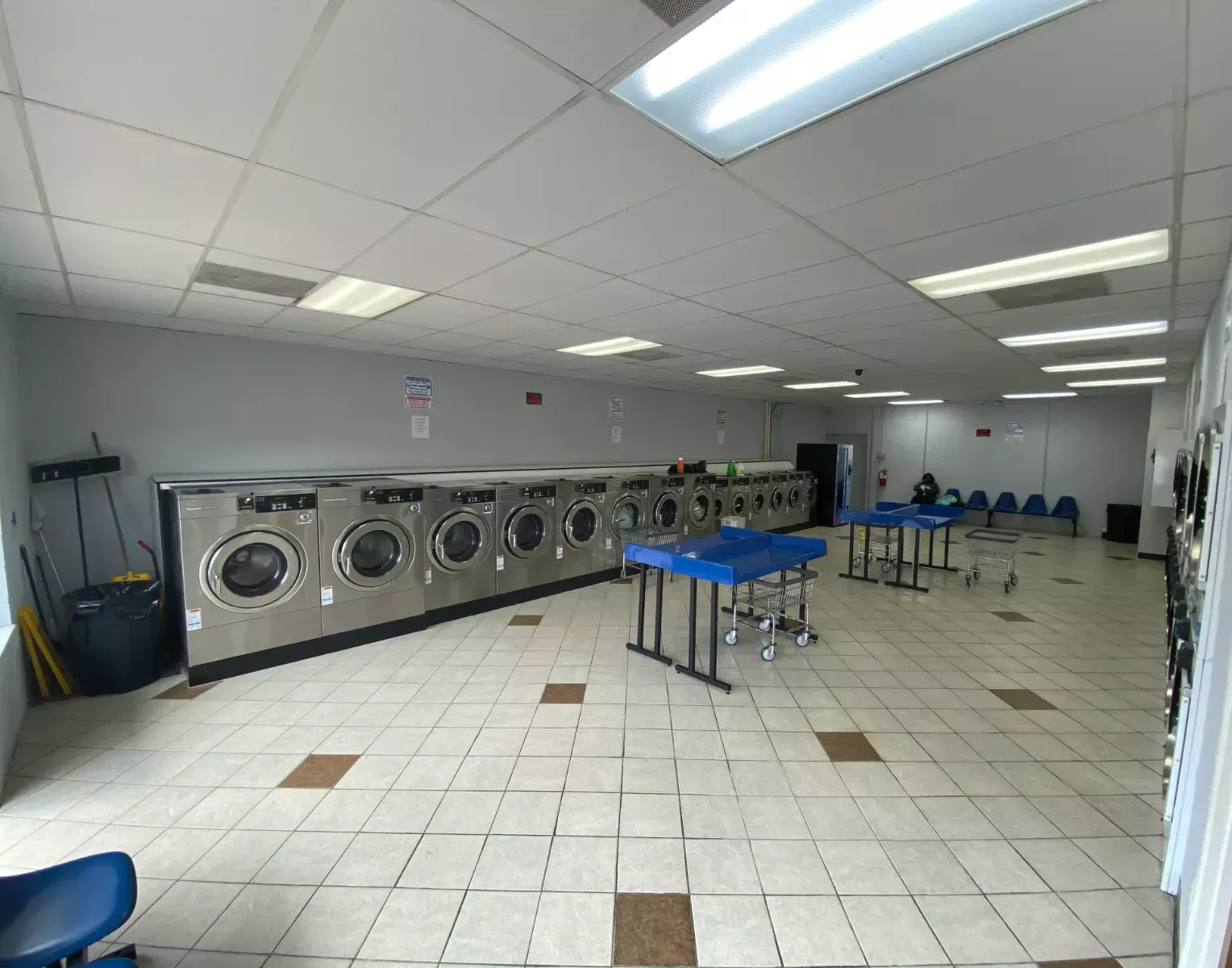 Long row of stainless steel washers and folding stations